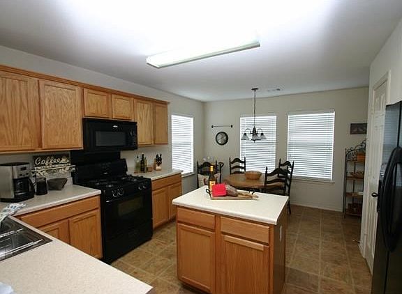 Spacious kitchen with center island, great storage and plenty of counter top space for all of your k