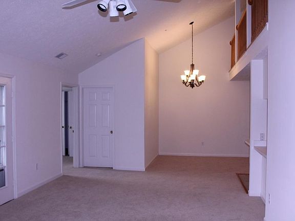 Dinning room area with doors to patio/balcony, bedroom and bathroom
