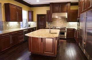 Grand kitchen with dark chocolate wooden floor