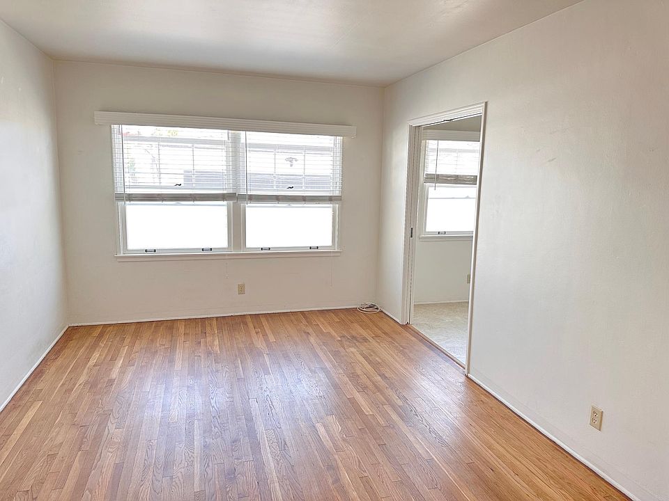 Living room view towards the kitchen.
The window wall is 11 ft long