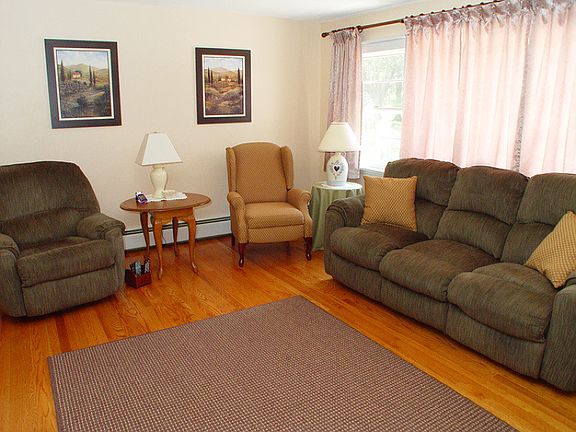 Living room flooded with natural sunlight fro large picture window