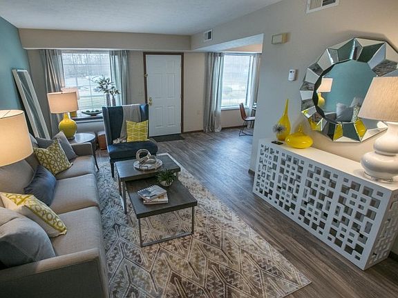 Living room with wood look flooring at Westchester Townhomes