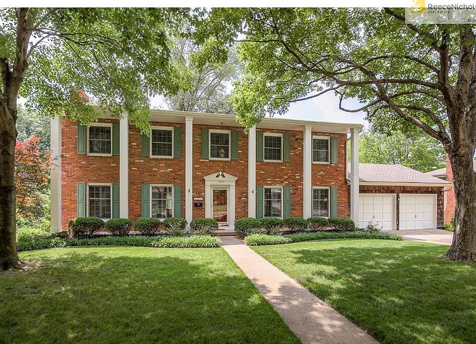 Large brick front two story with four bedrooms and two car garage in wonderful neighborhood!