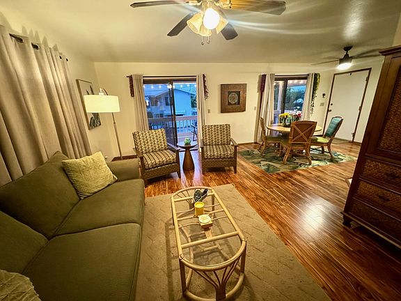 This photo is taken after stepping in the front door and looks from the living space towards the lanai and dining area.