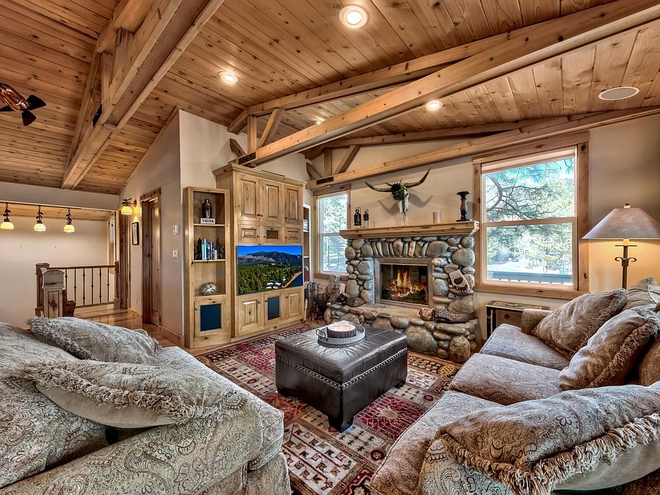 open floor plan, beamed ceilings, lots of natural light