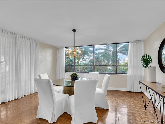 Corner Dining Room with Views of the Marina through the Tree Tops