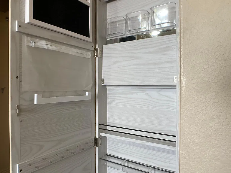 storage behind full length mirrors.