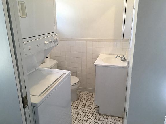 Downstairs half bath with stackable washer/dryer
