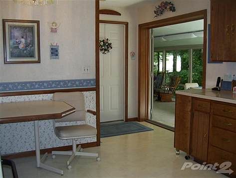 View from the kitchen into the four season room.