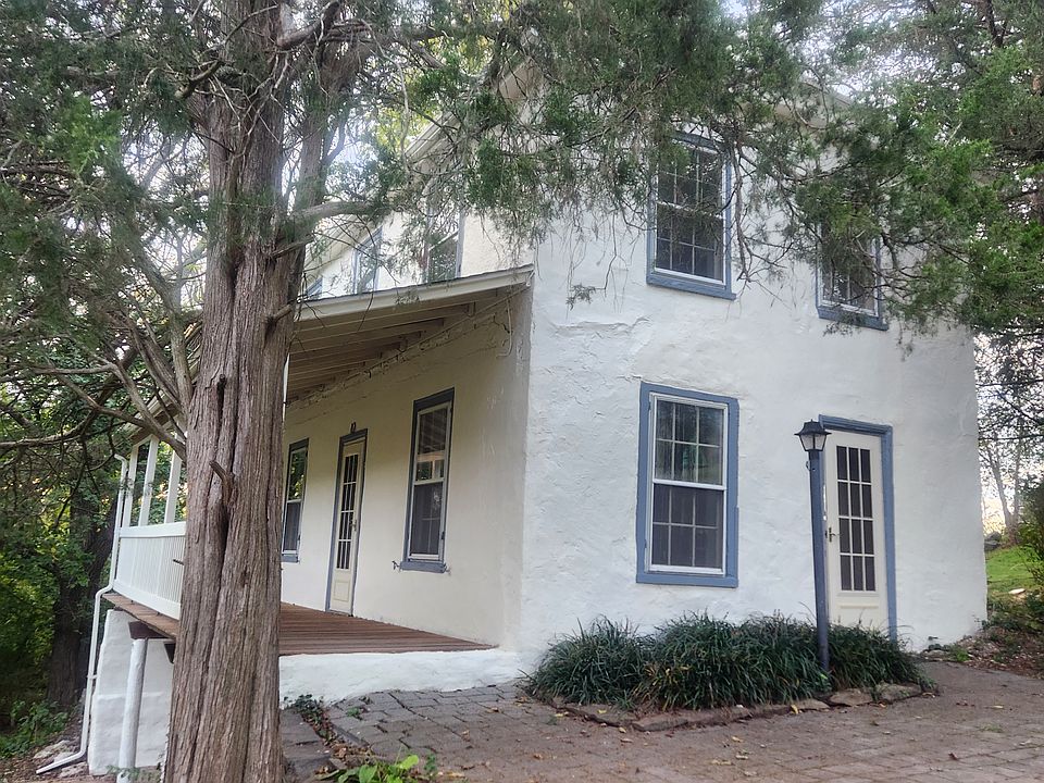 Front of home with side porch shown