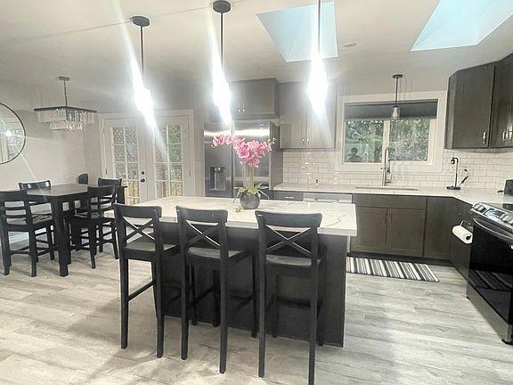 Kitchen with breakfast nook, lots of natural light from the two skylights