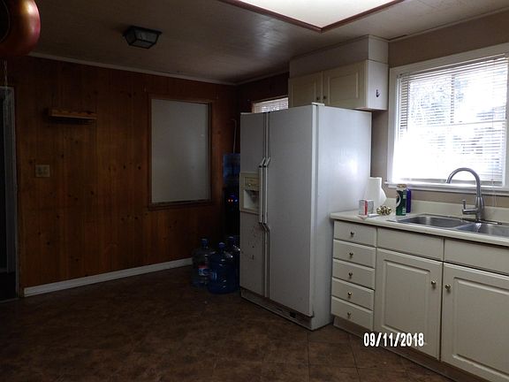 KITCHEN HAS no REFRIGERATOR. THE STOVE IS GAS.