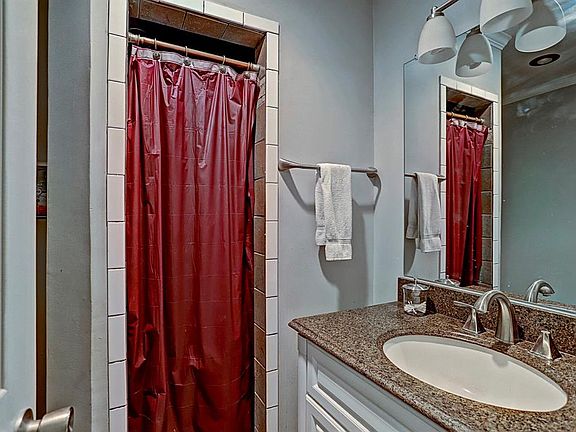 MASTER BATH IN UNIT #B WITH GRANITE COUNTERS AND RECENT PLUMBING HARDWARE!