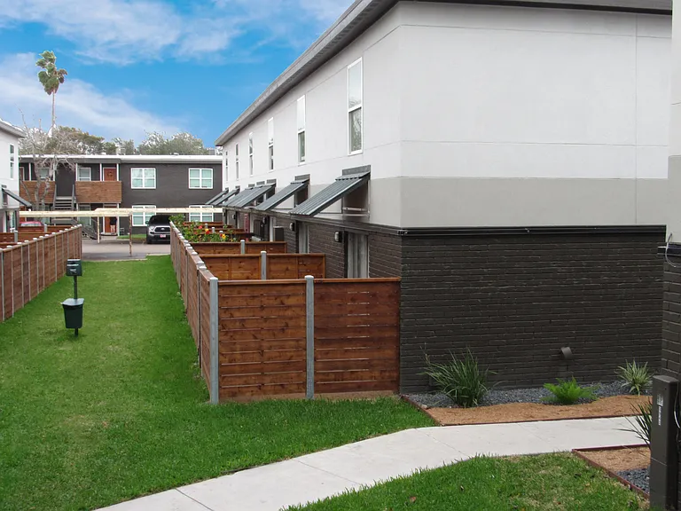 Relax outdoors in open lawn areas and fenced patios at Christy Estates Apartments.