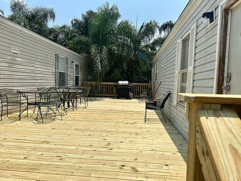 Porch, tables, chairs and bbq grill is provided.
