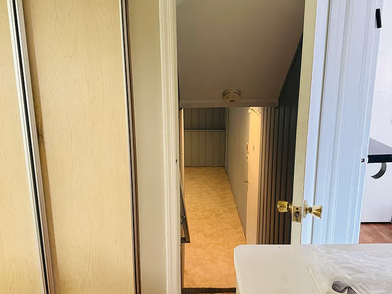 Heading to the basement through the door from the kitchen.
