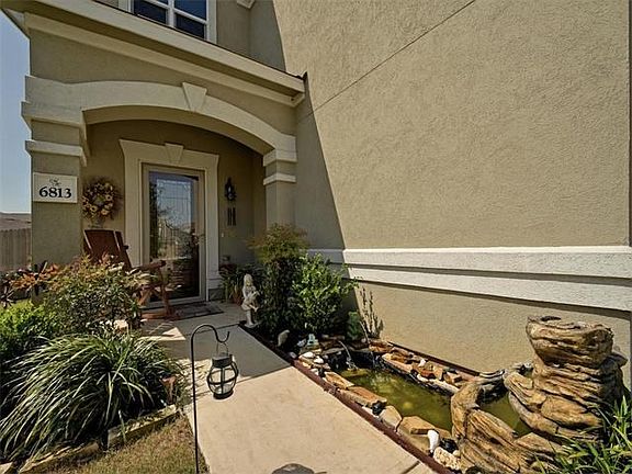 This home offers beautiful landscaping and a cute pond with a water feature! People know this is a nice home as soon as they walk up.