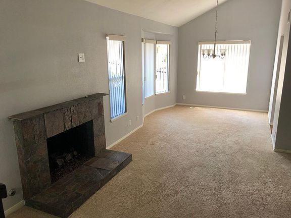 Living room dining room with wood burning fireplace