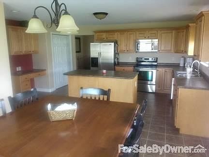 Large dining area
						:
						Custom cabinets with large pantry. Island in kitchen. Nice size dining area