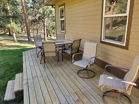 Private back deck for apartment with patio furniture
