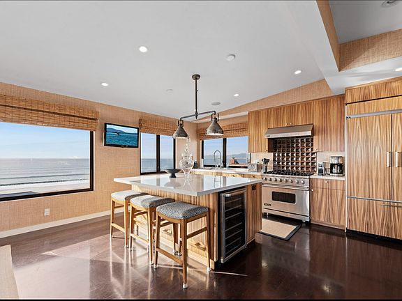 Gourmet Kitchen and center island and bar frig