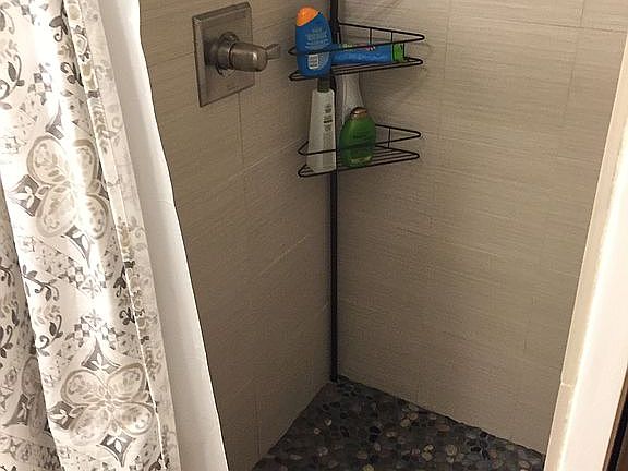 Upstairs stone/tile shower