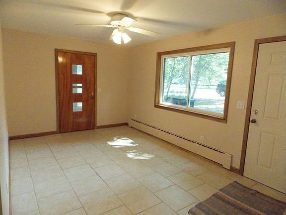 The family room has all new drywall and tile flooring. Notice the new windows continue throughout the home. 