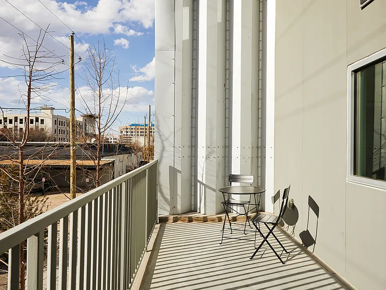 Step out onto the private balcony and take in the view while enjoying morning coffee or evening drinks at a bistro-style table with two cozy chairs.