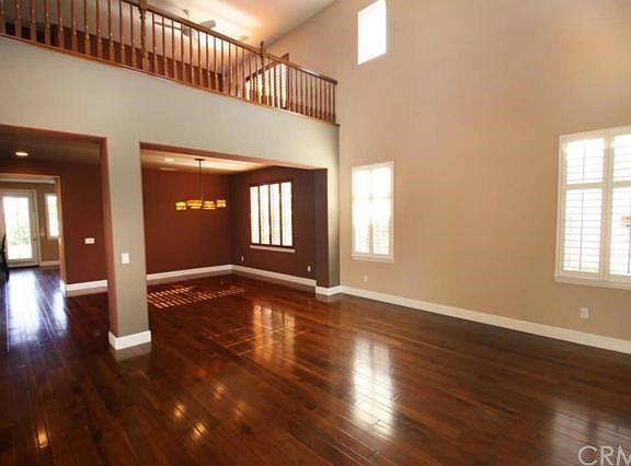 Hardwood flooring and plantation shutters throughout the home. Central vacuum system. Living Room is