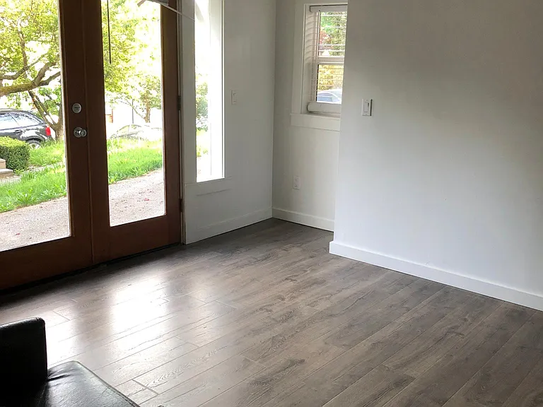 light filled living room with French doors to outside