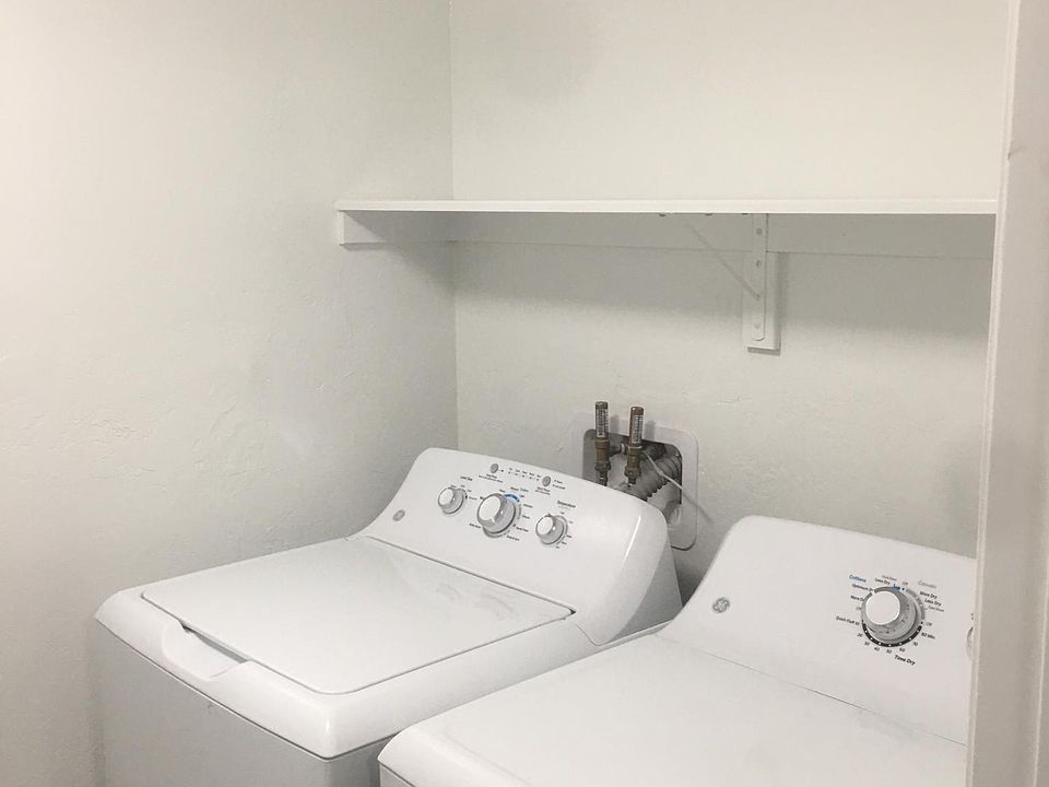 Laundry room inside house 