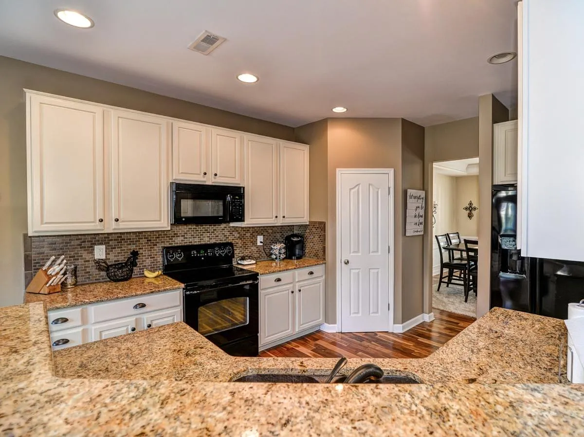 Newly painted cabinetry, granite and copper sink - 8208 Penman Springs Dr