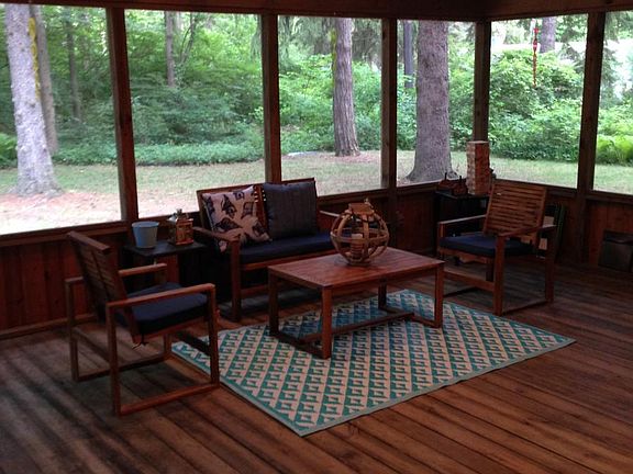 Oversized screen in porch overlooking corner lot with mature trees and privacy