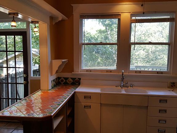 Spacious Kitchen looks out over yard and view of capital