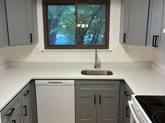 Double window over deep sink in kitchen.