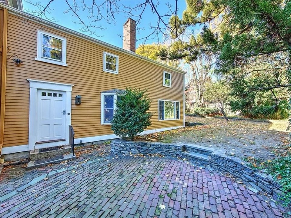 Unit entrance + backyard and patio