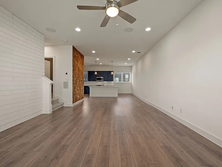 Beautiful and spacious open concept living room and dining room that pour into the kitchen area! Beautiful accent walls on the left.