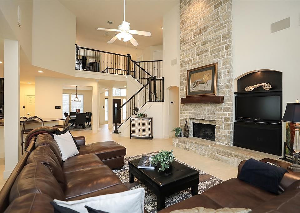 Stunning floor to ceiling stone fireplace with gas logs and elevated hearth. Recessed are for your tv or place it above the fireplace.