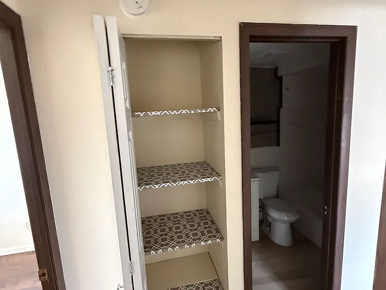 Linen closet right outside bathroom and both bedrooms