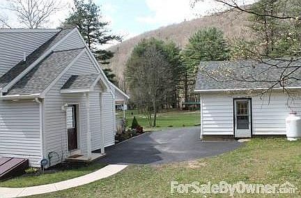 Paved Parking between House and Garage