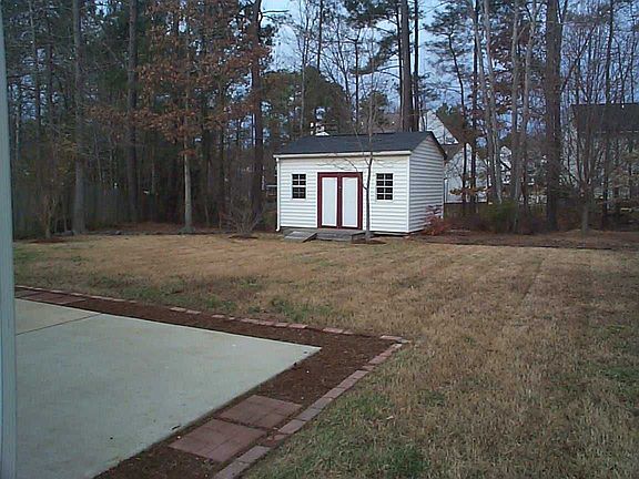 Flat Yard with Large Storage Shed