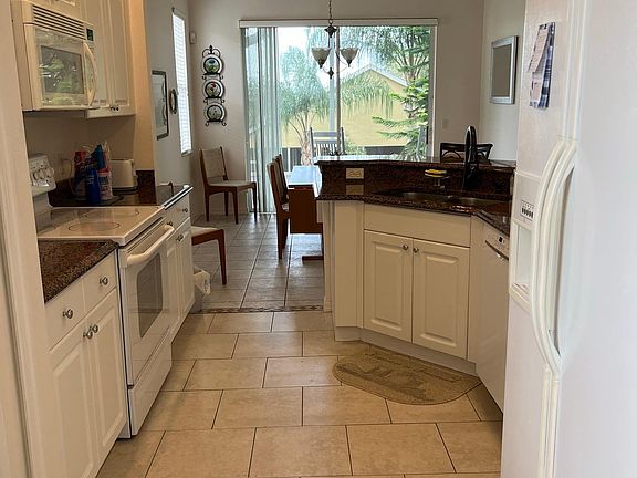 Kitchen has pantry, refrigerator/freezer, range/oven, dishwasher. Comes complete with dishes, flatware, cooking utensils, pots, pans, etc.