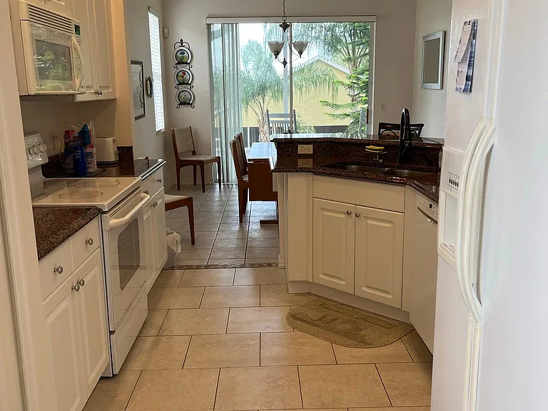 Kitchen has pantry, refrigerator/freezer, range/oven, dishwasher. Comes complete with dishes, flatware, cooking utensils, pots, pans, etc.