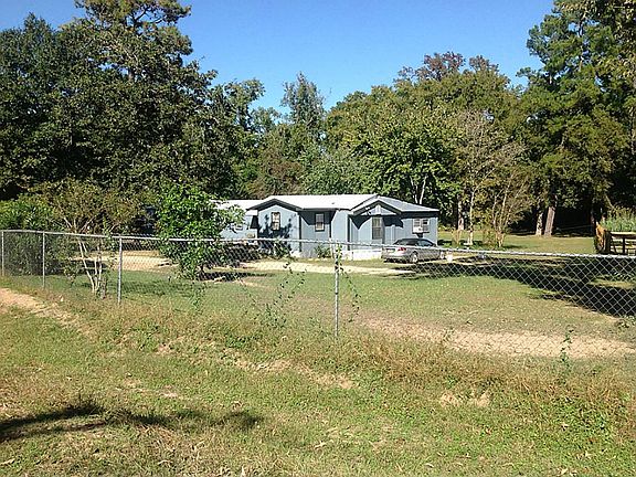 Beautiful trees, private well and 2 septics on this property in town