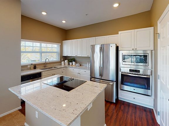 Modern kitchen with granite countertops and stainless steel appliances
