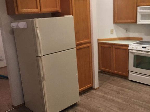 Kitchen w/ microwave, dishwasher & refrigerator