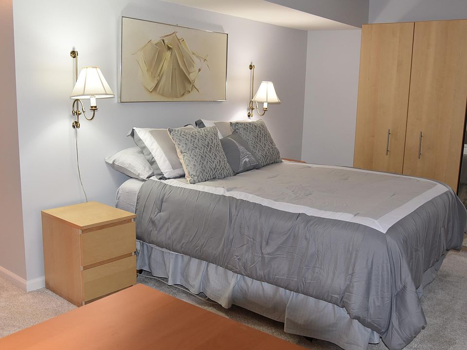 Bedroom with Queen-sized bed and ample closet space.