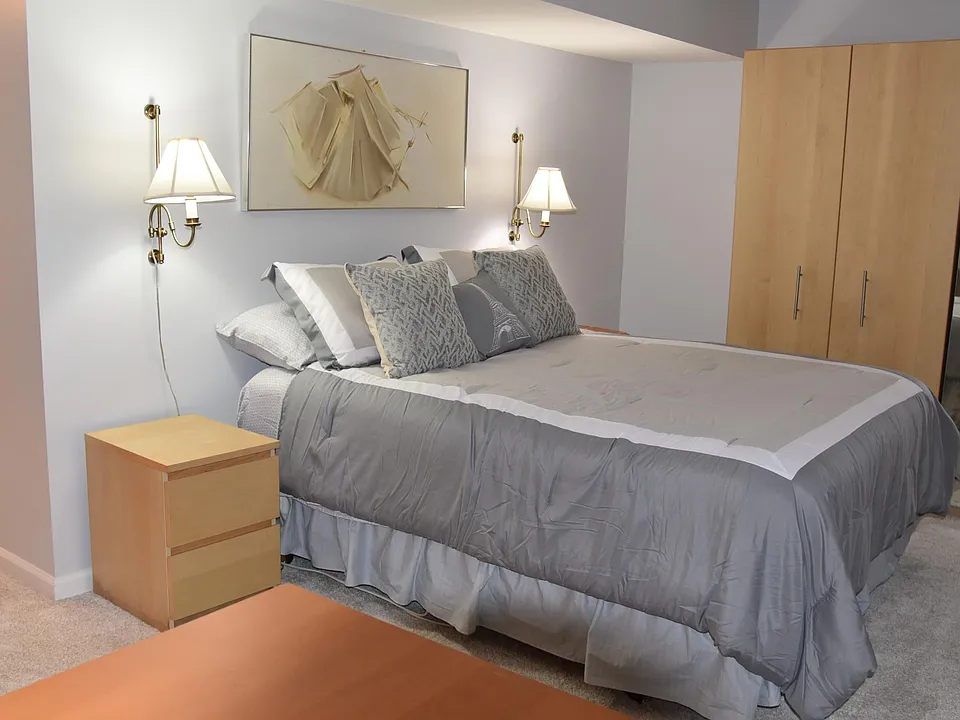 Bedroom with Queen-sized bed and ample closet space.