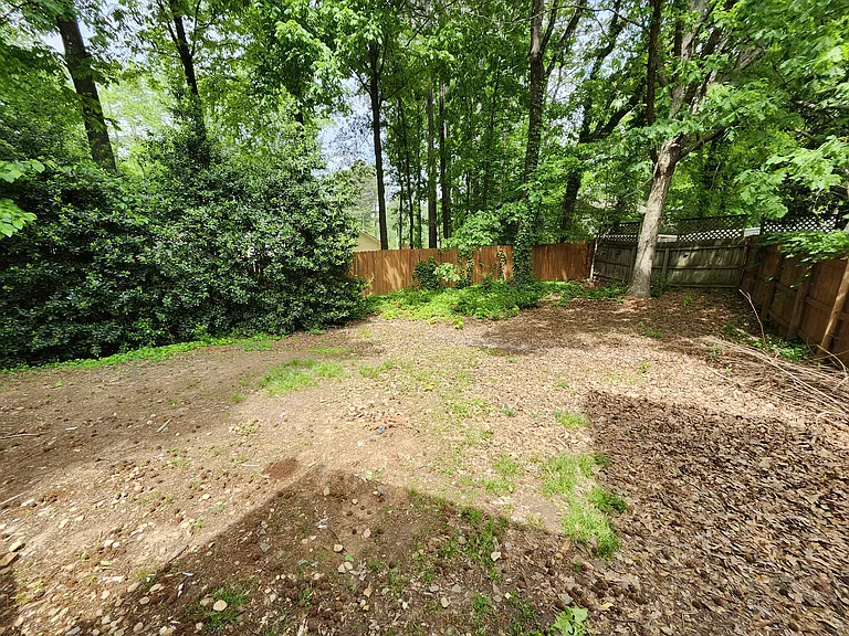 Large backyard with privacy fencing