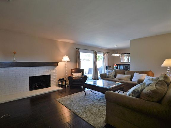 Gorgeous Dark Wood Laminate throughout Living Area and Hallw